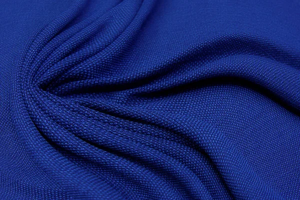 青い生地のテクスチャの背景 波状の生地の柔らかい青い色 豪華なサテンやシルクの布のテクスチャ — ストック写真