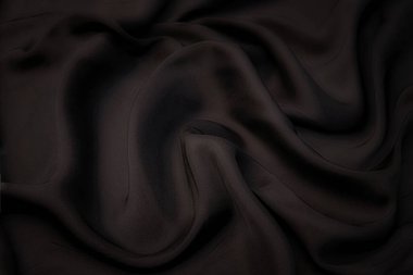 Doğal kahverengi kumaş ya da kumaşın yakın çekim dokusu aynı renkte. Doğal pamuk, ipek, yün veya keten kumaş dokusu. Kadife branda arka plan.