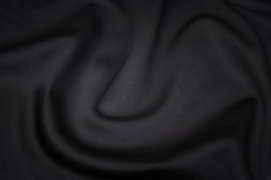 Doğal gri kumaşın yakın çekim dokusu ya da gri renkli kumaş. Doğal pamuk veya keten kumaş dokusu. Gri tuval arkaplanı