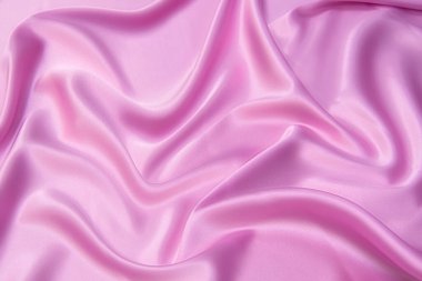 Doğal kırmızı ya da pembe kumaş ya da kumaşın yakın çekim dokusu aynı renkte. Doğal pamuk, ipek, yün veya keten kumaş dokusu. Kırmızı tuval arkaplanı.