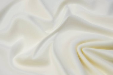 Doğal bej kumaşın yakın çekim dokusu ya da kahverengi renkli kumaş. Doğal pamuk veya keten kumaş dokusu. Bej tuval arkaplanı.