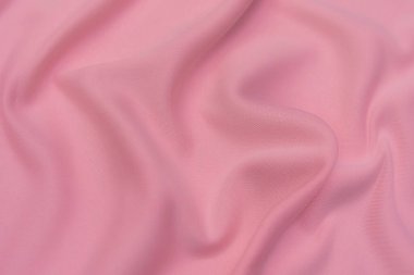 Doğal kırmızı ya da pembe kumaş ya da kumaşın yakın çekim dokusu aynı renkte. Doğal pamuk, ipek, yün veya keten kumaş dokusu. Kırmızı ve turuncu tuval arkaplan.