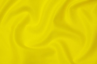 Doğal turuncu ya da sarı kumaş ya da kumaşın yakın çekim dokusu aynı renkte. Doğal pamuk, ipek, yün veya keten kumaş dokusu. Sarı tuval arkaplanı.