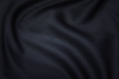 İpek, pamuk ya da yün kumaş dokusu. Koyu gri ya da siyah renk. Doku, arkaplan, desen.