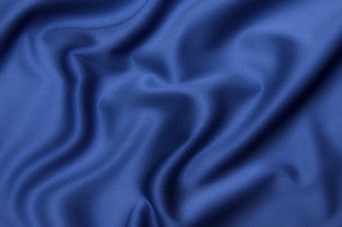 Doğal mavi kumaş ya da kumaşın yakın çekim dokusu aynı renkte. Doğal pamuk, ipek ya da yün kumaş dokusu. Mavi tuval arkaplanı.