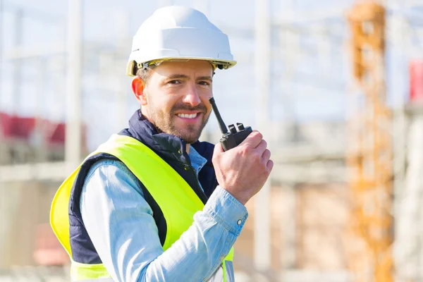 Portrait of an attractive worker on a construction site — Stock Photo, Image