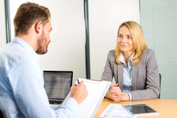 Young attractive woman during job interview — Stock Photo, Image