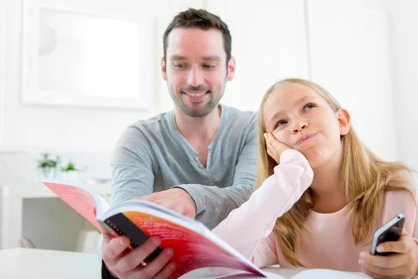 Young lazy girl prefers her mobile phone — Stock Photo, Image