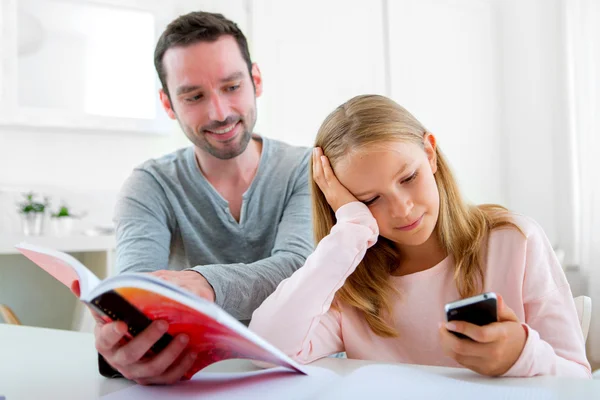 Young lazy girl prefers her mobile phone — Stock Photo, Image
