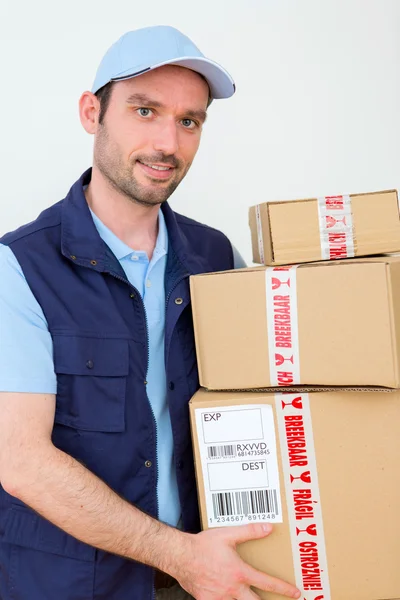 Delivery man on a white background — Stock Photo, Image
