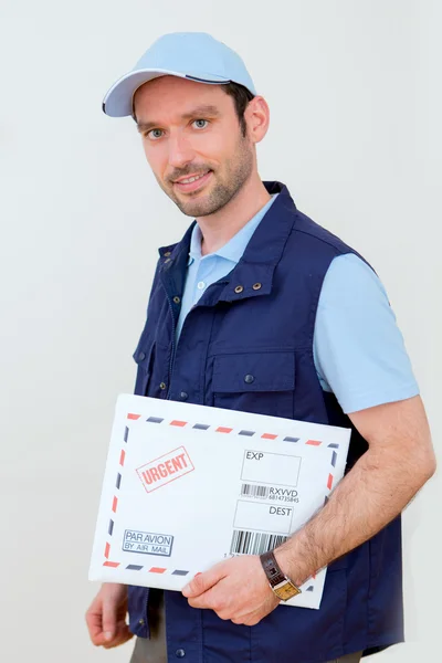 Delivery man on a white background — Stock Photo, Image