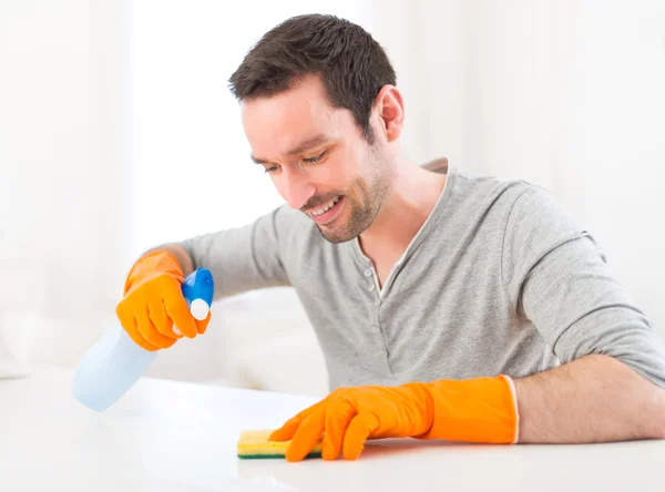 Young attractive man cleaning his flat — Stock Photo, Image