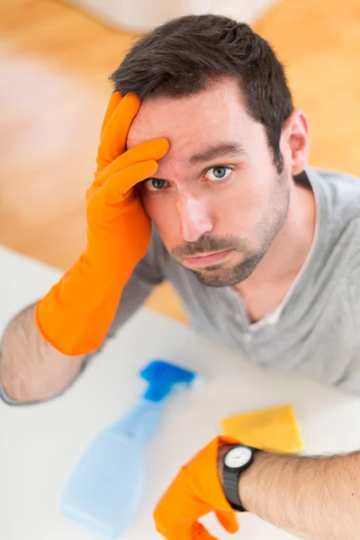 Young attractive man cleaning his flat — Stock Photo, Image