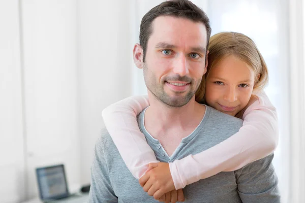 Young girl hugging his father — Stock Photo, Image
