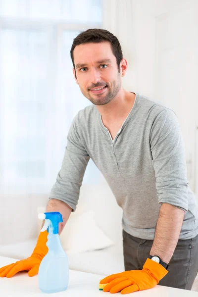 Young attractive man cleaning his flat — Stock Photo, Image