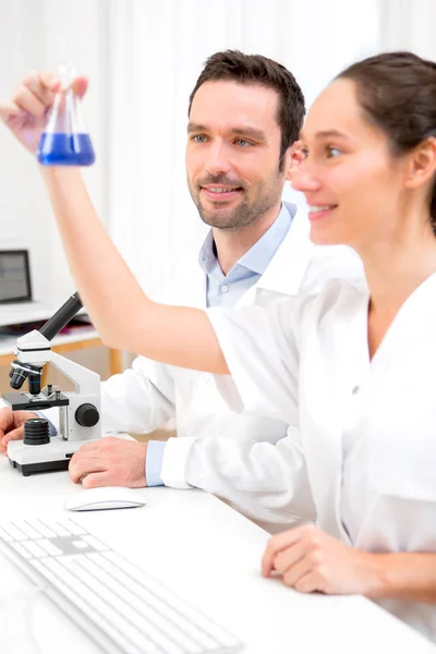 Scientists working together in a laboratory — Stock Photo, Image