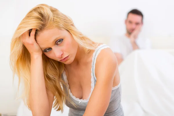 Young attractive couple having an argue in bed — Stock Photo, Image