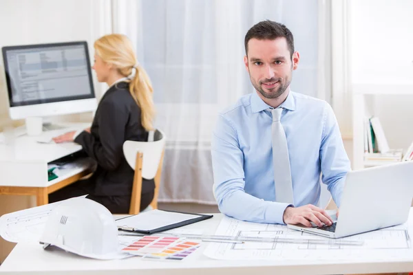 Young attractive engineer working at the office — Stock Photo, Image