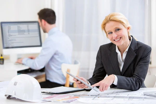 Young attractive engineer working at the office — Stock Photo, Image