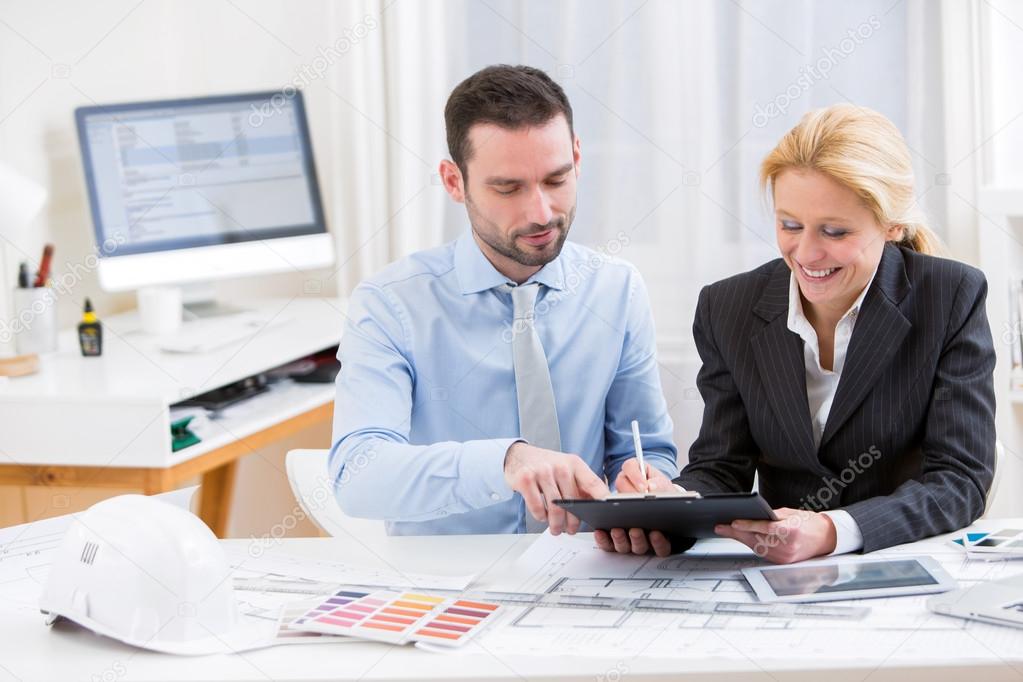 Engineer and architect working at the office