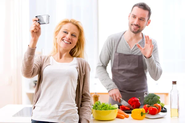 Young attractive woman taking selfie in kitchen — Stock Photo, Image