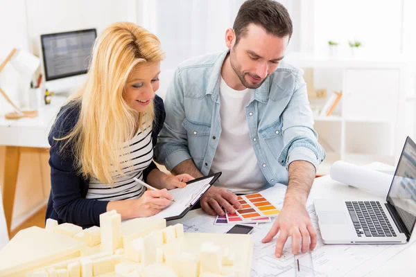 Two attractives architect working at the office — Stock Photo, Image