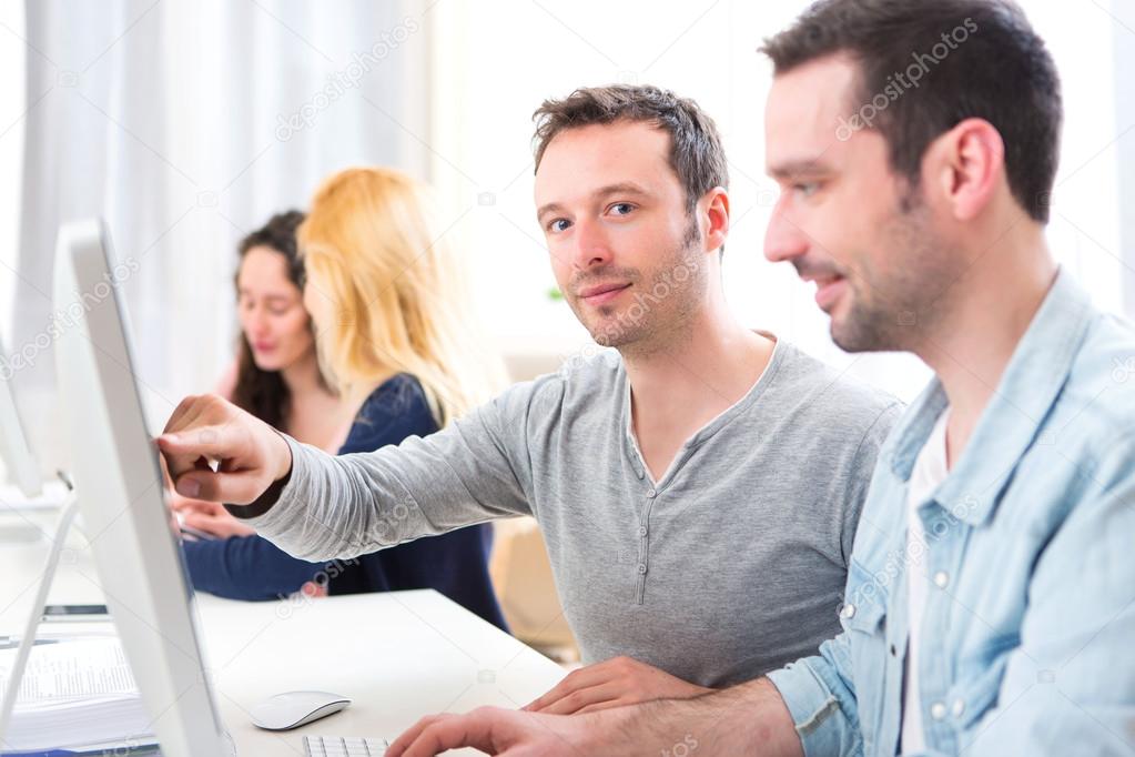 Portrait of a Young attractive men working at the office 