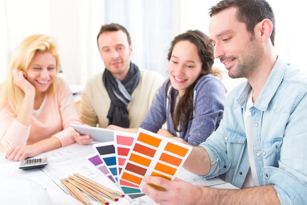 Architect students choosing colors for their project Royalty Free Stock Images