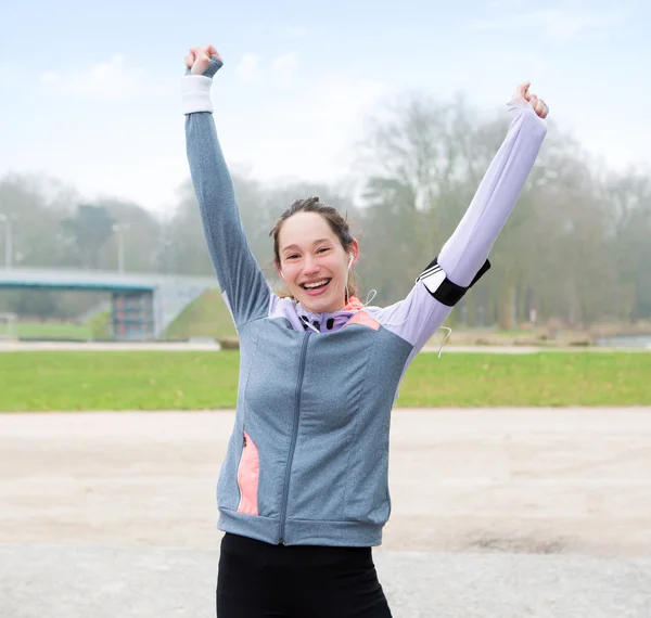 Young attractive woman just finishing a running session — Stock Photo, Image