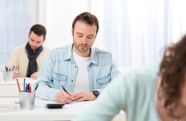 Young attractive man taking exams — Stock Photo, Image