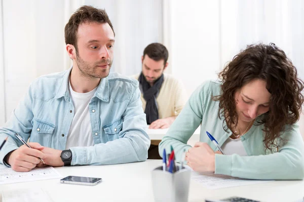Classmate try to cheat on his neighbour — Stock Photo, Image