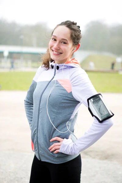 Portrait of a young attractive woman after a running session — Stock Photo, Image