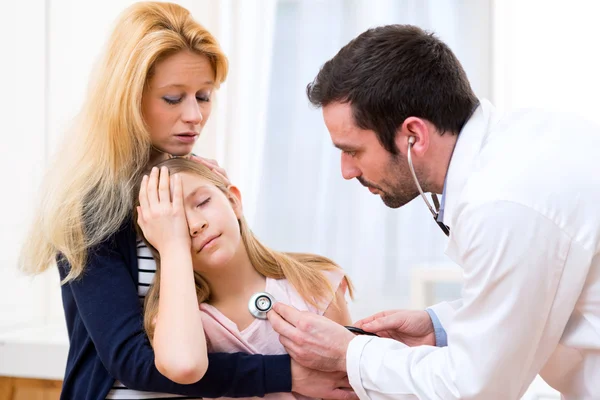 Doctor listening heart beatment of little girl Stock Photo