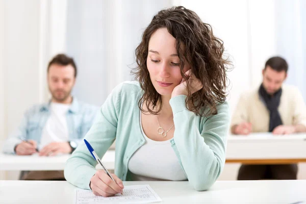Young attractive student during lessons at school — Stock Photo, Image