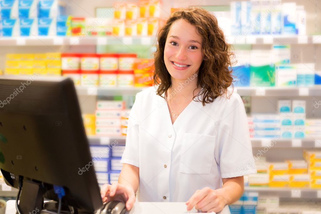Portrait of an attractive pharmacist at work