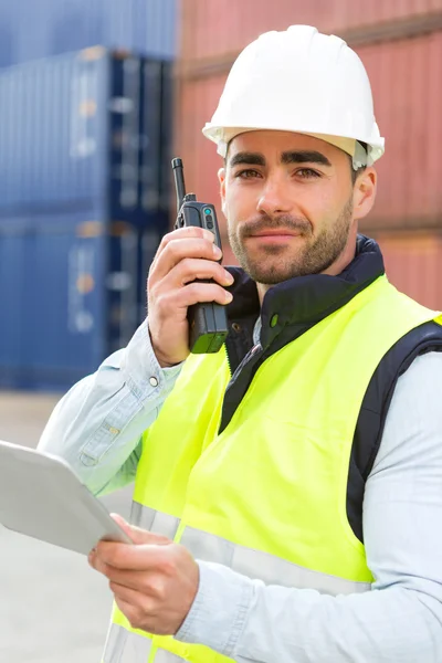 Young Attractive docker using tablet at work — Stock Photo, Image