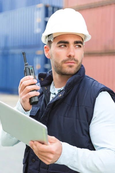 Young Attractive docker using tablet at work — Stock Photo, Image