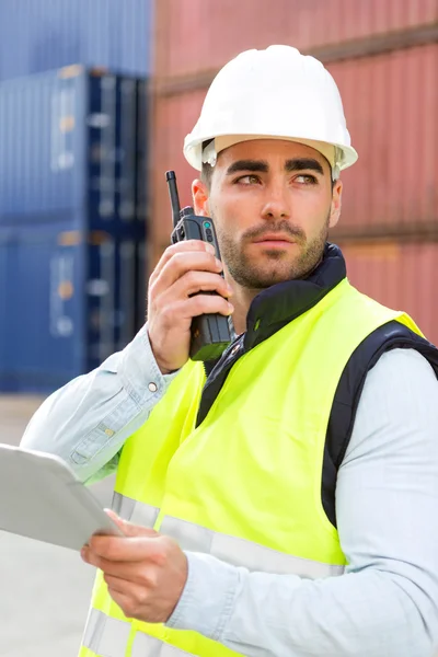 Young Attractive docker using tablet at work — Stock Photo, Image