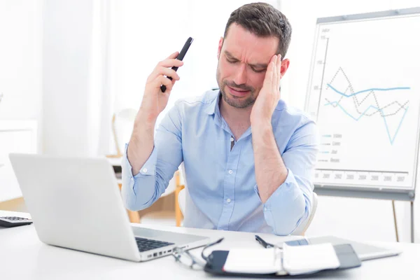 Young attractive business got headache because of mobile phone — Stock Photo, Image