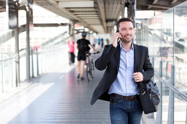 Young attractive business man using smartphone — Stock Photo, Image