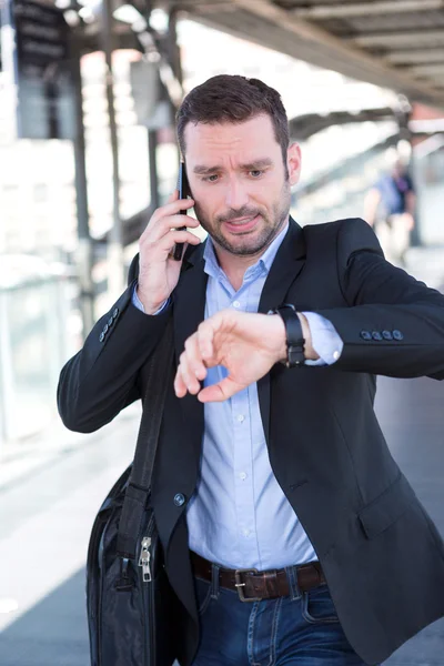 Young attractive man being late to an appointment — Stock Photo, Image