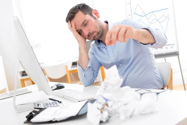 Young attractive man too tired to work — Stock Photo, Image