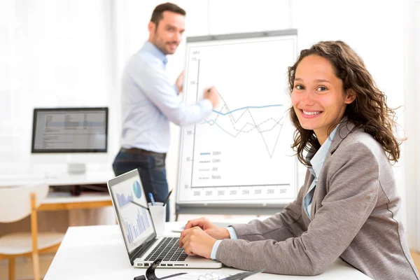 Business man and woman analysing stats while doing video confere — Stock Photo, Image