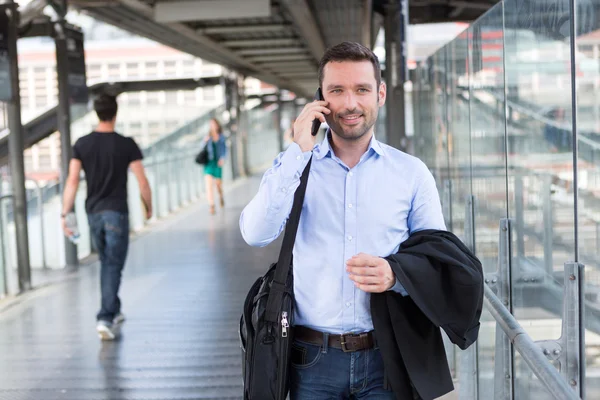 Young attractive business man using smartphone — Stock Photo, Image