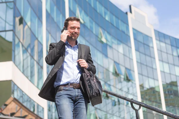 Young attractive business man using smartphone — Stock Photo, Image