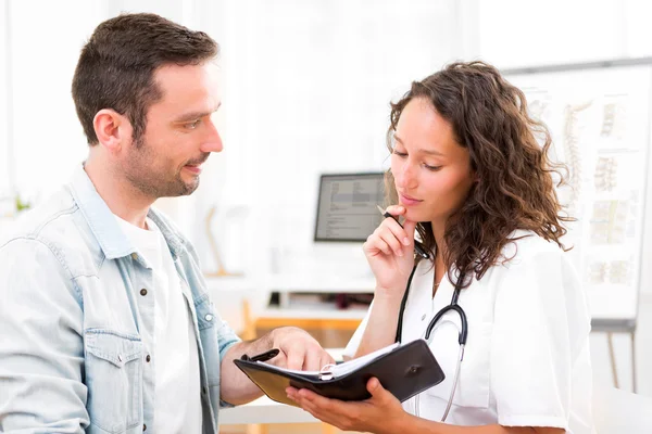 Young attractive doctor dating next appointment — Stock Photo, Image