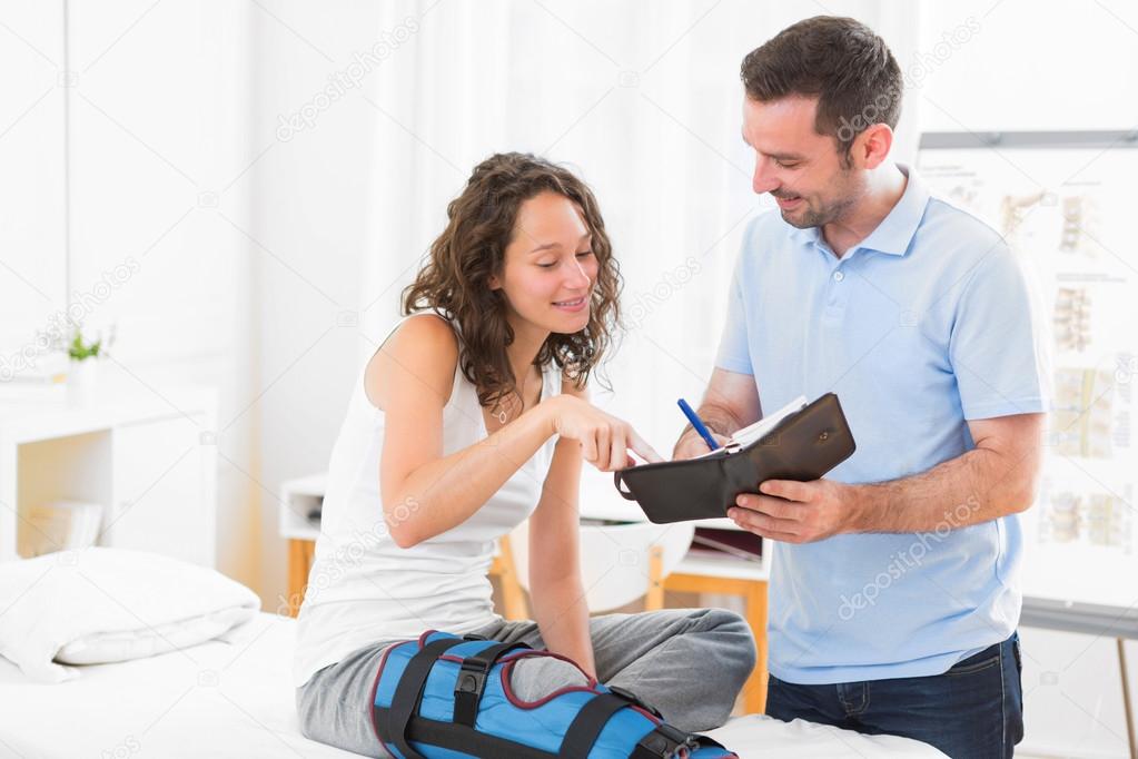 Young attractive physiotherapist dating next appointment