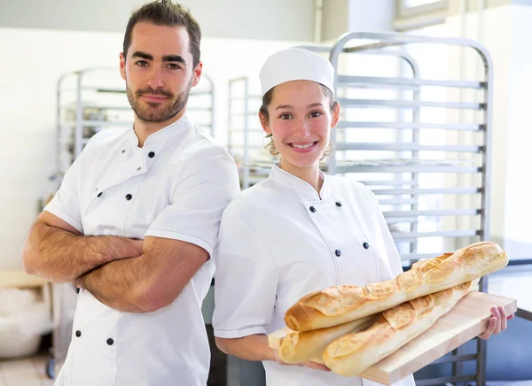 Team of bakers working at the bakery — Stock Photo, Image