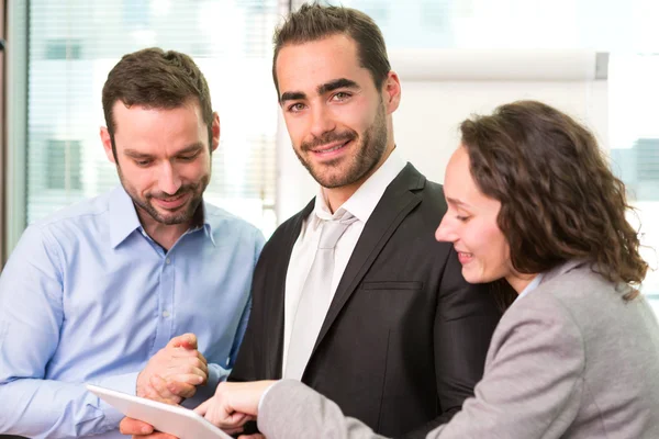Group of business associates working together at the office — Stock Photo, Image