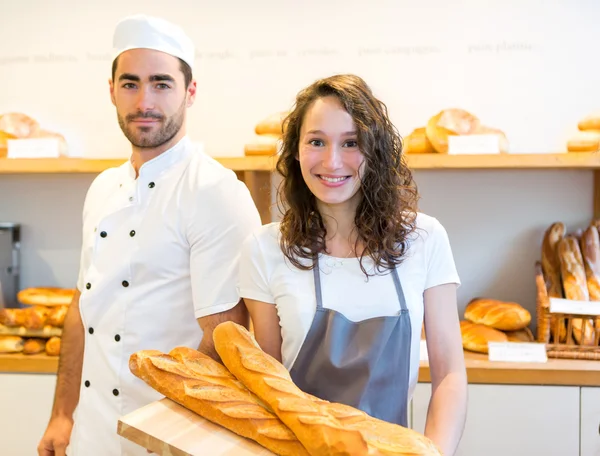 Team of bakers working at the bakery — Stock Photo, Image